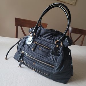 Authentic Tod’s nylon cross body bag, color back, preowned.